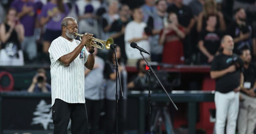 Dr. Jesse McGuire performs the national anthem before the MLB game between the Arizona Diamondbacks and the New York Yankees at Chase Field on Sept. 19, 2026, in Phoenix, Arizona.