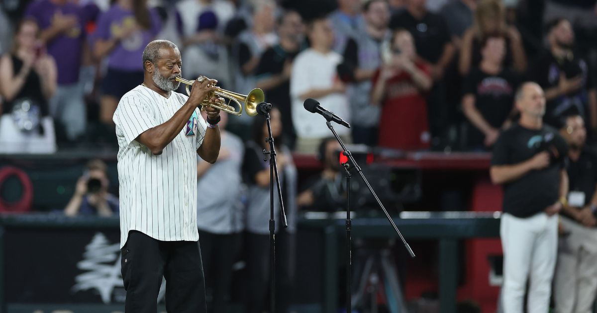 Dr. Jesse McGuire performs the national anthem before the MLB game between the Arizona Diamondbacks and the New York Yankees at Chase Field on Sept. 19, 2026, in Phoenix, Arizona.