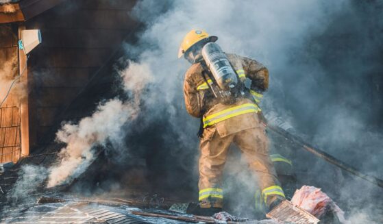 During a fire in Saint-Hugues, Quebec, on the evening of April 25, 2004, firefighters from the municipality as well as neighboring municipalities are battling the blaze.