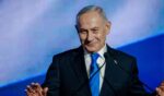 Israeli Prime Minister and Likud party leader Benjamin Netanyahu speaks to supporters at the lectern during a party campaign rally at Expo Tel Aviv on Sept. 17, 2026, in Tel Aviv, Israel.