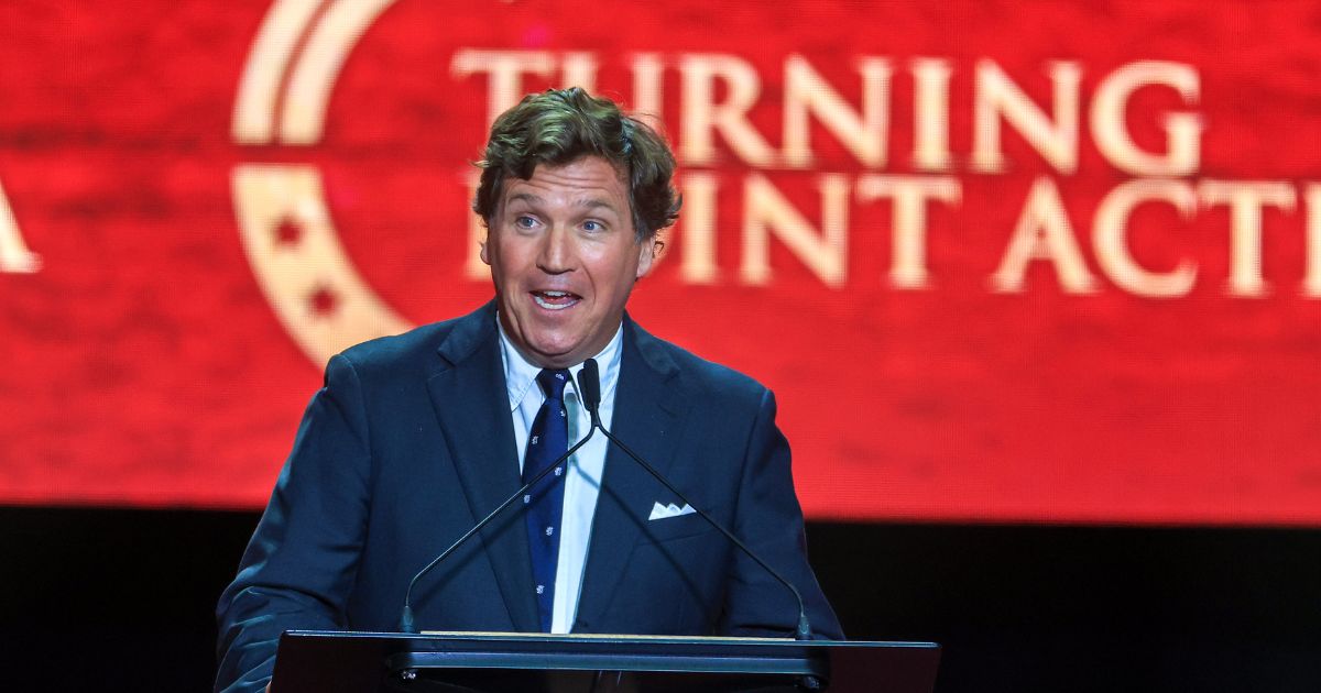 Political commentator Tucker Carlson speaks during the memorial service for political activist Charlie Kirk at State Farm Stadium on Sept. 21, 2025, in Glendale, Arizona.