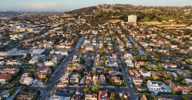 In an aerial view, luxury single-family homes and residential neighborhoods are seen along the coastal community of La Jolla on Aug. 28, 2026, in San Diego, California.