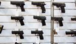 A gun wall rack with pistols.