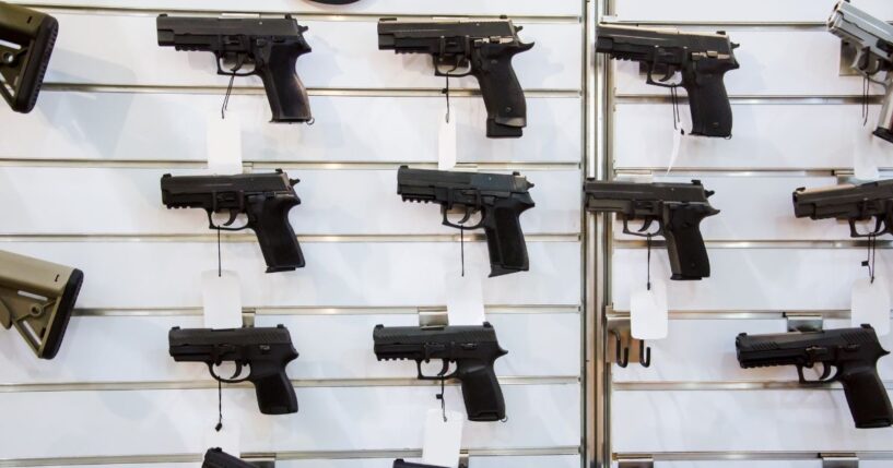 A gun wall rack with pistols.
