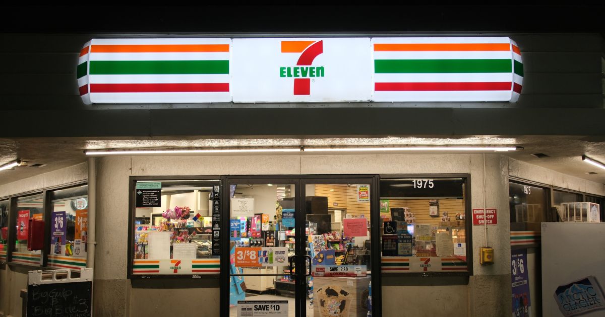 A 7-Eleven convenience store facade at night in Merced, California, on June 10, 2024.