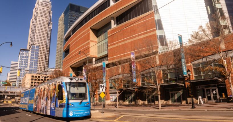 The electric light rail mass transit is seen driving through an empty city street on a sunny, but freezing cold winter day in Charlotte, North Carolina, on Dec. 16, 2025.