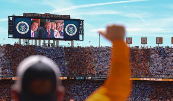 President Donald Trump, Sen. Bill Hagerty, and Sen. Marsha Blackburn appear on a video screen while attending the Texas-Tennessee football game at Neyland Stadium on Sept. 26, 2026, in Knoxville, Tennessee.