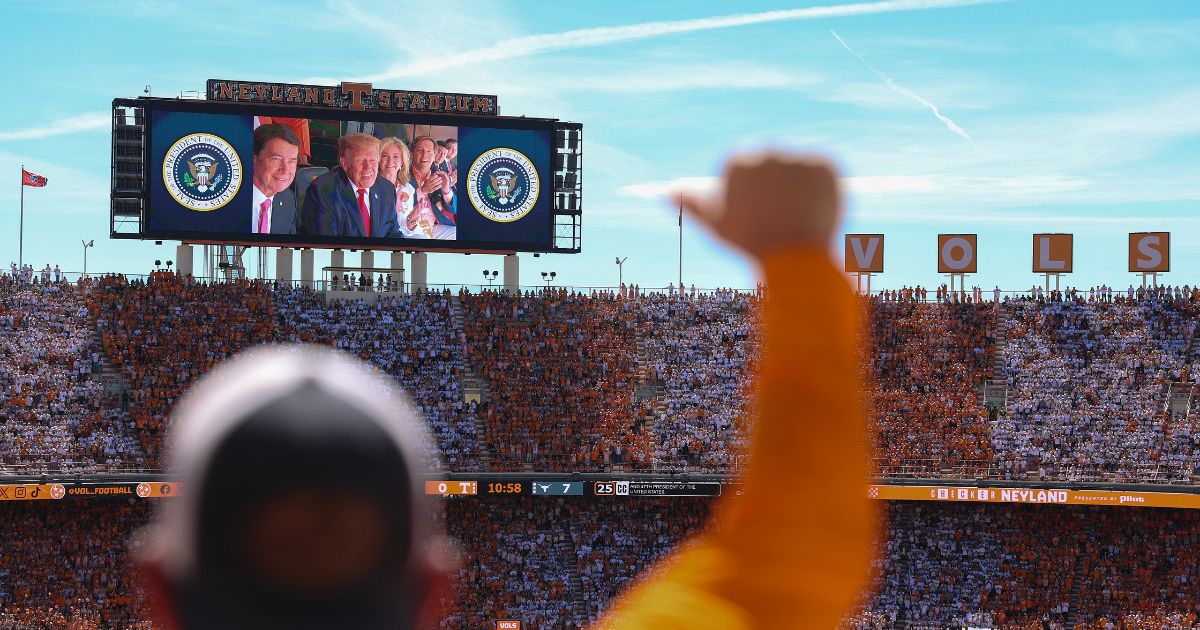 President Donald Trump, Sen. Bill Hagerty, and Sen. Marsha Blackburn appear on a video screen while attending the Texas-Tennessee football game at Neyland Stadium on Sept. 26, 2026, in Knoxville, Tennessee.