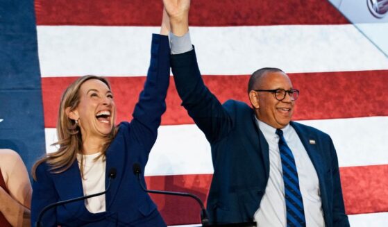 New Jersey Democratic Gov. Mikie Sherrill celebrates with Lt. Gov. Dale Caldwell after their win during an election night watch party at the Hilton East Brunswick Hotel on Nov. 4, 2025, in East Brunswick, New Jersey.