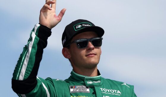 Corey Heim, driver of the Fleetio Toyota, waves to fans as he walks onstage during driver intros prior to the NASCAR Cup Series Cook Out Southern 500 at Darlington Raceway on Sept. 6, 2026, in Darlington, South Carolina.