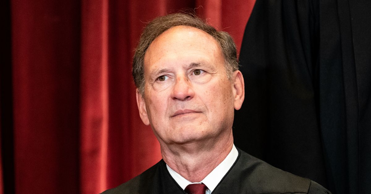 Associate Justice Samuel Alito sits during a group photo of the Justices at the Supreme Court in Washington, D.C., on April 23, 2021.