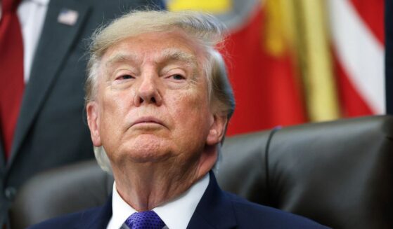 President Donald Trump listens to a reporter's question in the Oval Office at the White House on Sept. 28, 2026, in Washington, D.C.