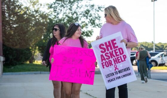 Supporters of Lindsay Clancy hold signs outside the Plymouth County Superior Court during Lindsay Clancy's murder trial in Plymouth, Massachusetts, on Aug. 26, 2026.