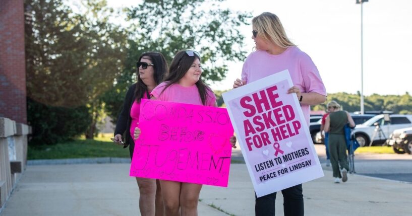 Supporters of Lindsay Clancy hold signs outside the Plymouth County Superior Court during Lindsay Clancy's murder trial in Plymouth, Massachusetts, on Aug. 26, 2026.