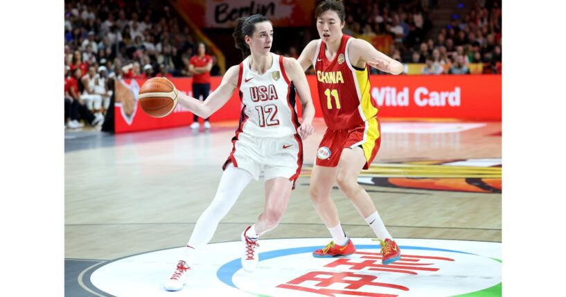 Caitlin Clark of USA dribbles under pressure from Xinyu Luo of China during the FIBA Women's Basketball World Cup Germany 2026 match between USA and China Friday in Berlin, Germany.