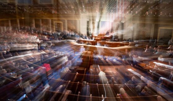 In a slow-shutter exposure, members of Congress congregate on the floor of the House Chamber of the U.S. Capitol Building in Washington, D.C., in a 2023 file photo.