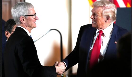 President Donald Trump greets Apple CEO Tim Cook during an October 2025 meeting in Tokyo, Japan.