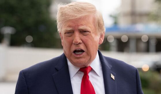 President Donald Trump, seen in a Saturday photo, called the Axios story a "hoax" and urged the political news outlet to retract it.