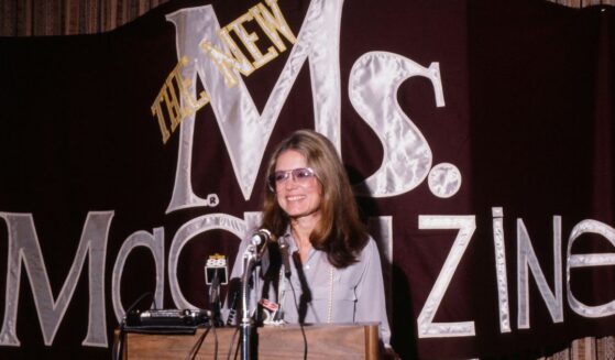 Feminist author Gloria Steinem speaks from a podium at a 1985 news conference about Ms magazine, which she cofounded.