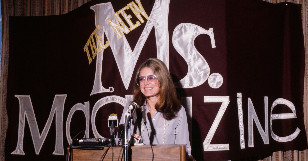 Feminist author Gloria Steinem speaks from a podium at a 1985 news conference about Ms magazine, which she cofounded.