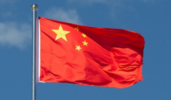 A Chinese flag flies in the wind.