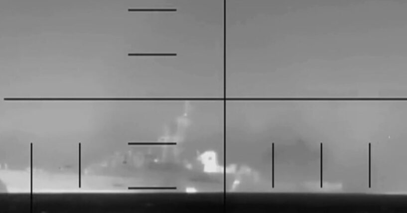 A camera shot of an Iranian frigate, the IRIS Dena, sinking while in flames on March 4, 2026.