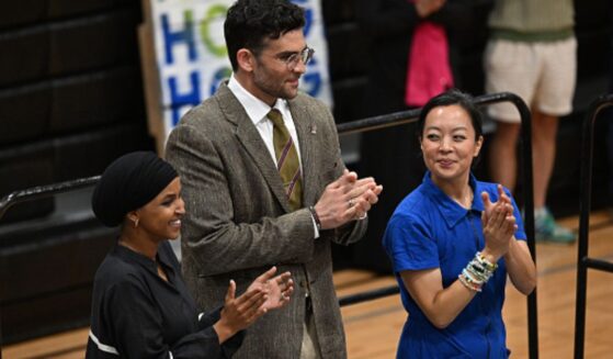 Hasan Piker stands beside Wisconsin Gubernatorial candidate Francesca Hong and Congresswoman Ilhan Omar at a rally in Milwaukee, Wisconsin.