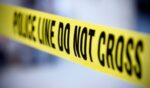 Yellow police tape is pictured.
