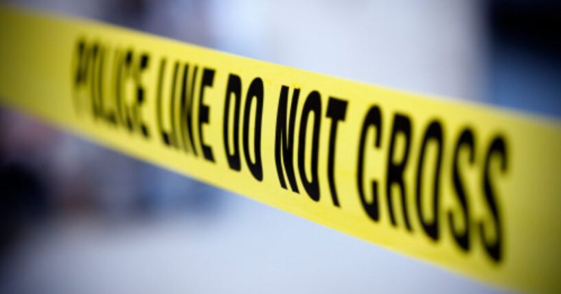 Yellow police tape is pictured.