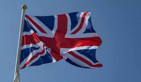 The flag of the United Kingdom waves in the wind on a beach in Northern France on June 18, 2025.