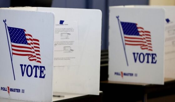 The voting booths stand on a table.