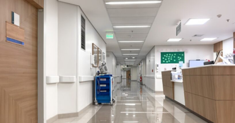 An empty hospital hallway is pictured.