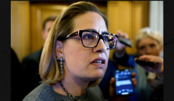 Then-Sen. Kyrsten Sinema of Arizona is seen in a 2024 photo speaking to reporters at the U.S. Capitol Building in Washington, D.C.