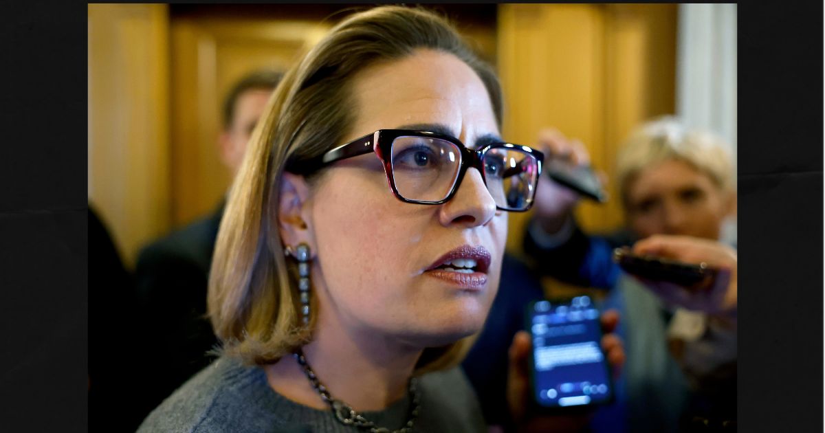 Then-Sen. Kyrsten Sinema of Arizona is seen in a 2024 photo speaking to reporters at the U.S. Capitol Building in Washington, D.C.