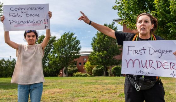 Demonstrators call for a first-degree murder verdict Tuesday as they protest outside the courthouse during the jury deliberation phase of Lindsay Clancy's murder trial at the Plymouth County Superior Court in Plymouth, Massachusetts.