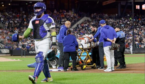 Jared Young #29 of the New York Mets is carried off the field on a stretcher Thursday after a collision at first base with teammate Nolan McLean during the sixth inning against the Philadelphia Phillies at Citi Field in New York City.