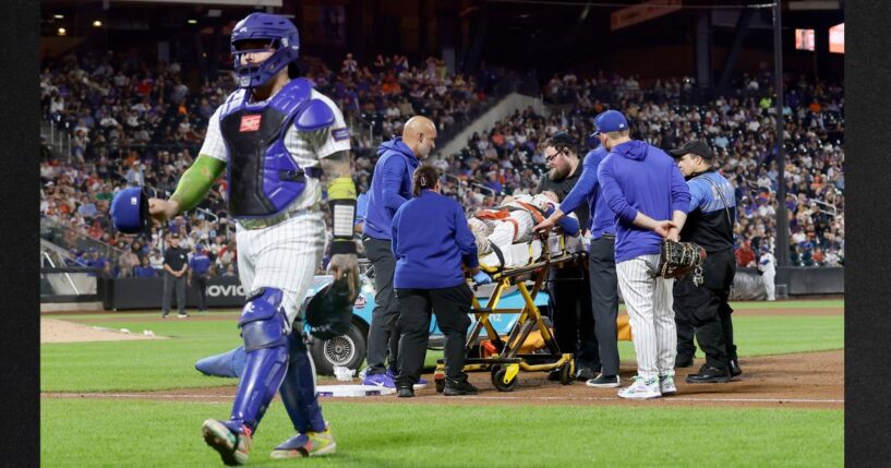 Jared Young #29 of the New York Mets is carried off the field on a stretcher Thursday after a collision at first base with teammate Nolan McLean during the sixth inning against the Philadelphia Phillies at Citi Field in New York City.