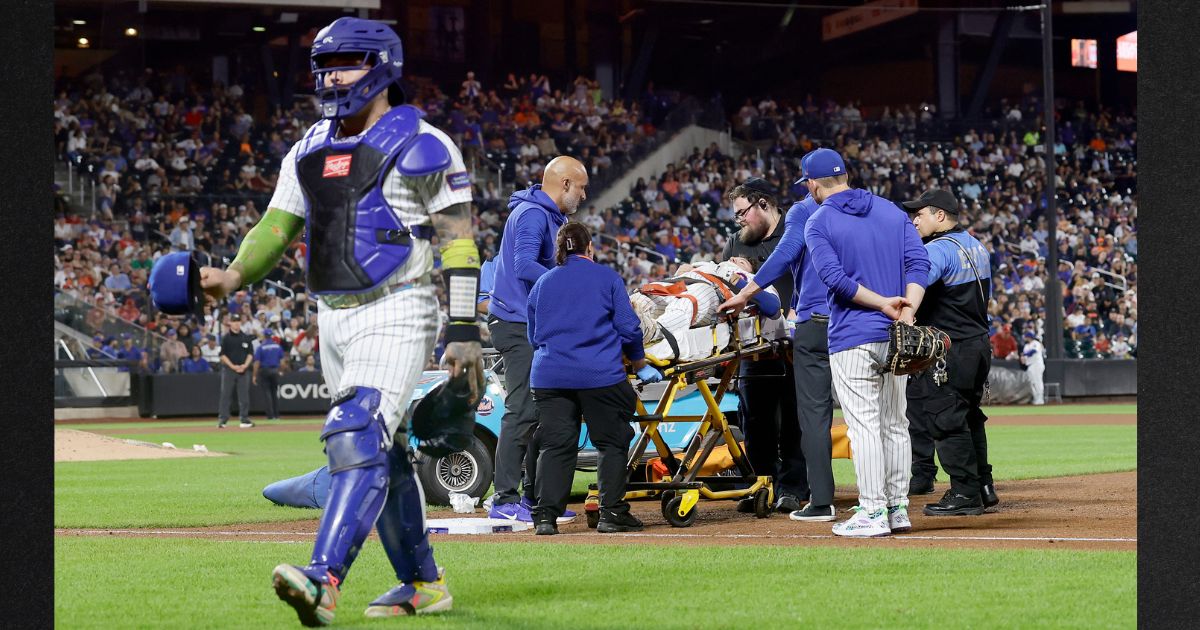Jared Young #29 of the New York Mets is carried off the field on a stretcher Thursday after a collision at first base with teammate Nolan McLean during the sixth inning against the Philadelphia Phillies at Citi Field in New York City.