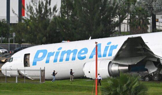 Officials investigate a recently crashed Amazon cargo plane at Miami International Airport on Sept. 6, 2026 in Miami, Florida.