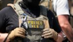 An Immigration and Custom's Enforcement agent stands in Newark, New Jersey, on May 26, 2026.