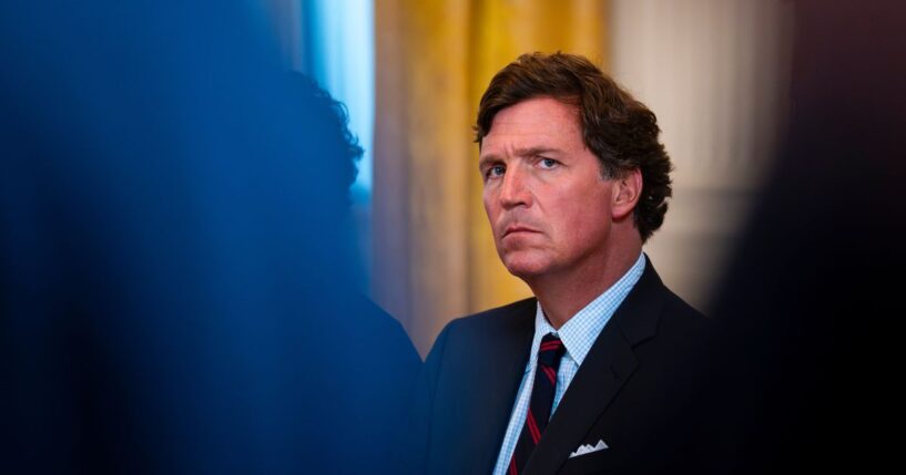Tucker Carlson looks on in the East Room of the White House on Jan. 9, 2026 in Washington.