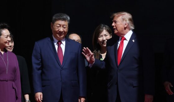 President of China Xi Jinping, First Lady of China Peng Liyuan, President Donald Trump and First Lady Melania Trump walk together outside the National Archives Museum in Washington on Sept. 25, 2026.