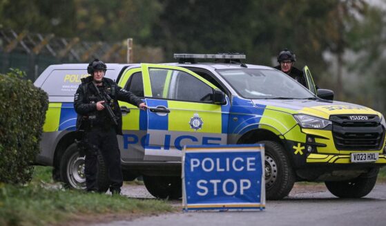 Armed police block a road leading into RAF Fairford air base outside London, which has been used to facilitate US strikes in Iran on Sept. 27, 2026.