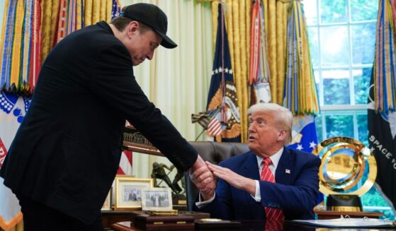 President Donald Trump shakes hands with Elon Musk in the Oval Office of the White House in Washington, D.C, in a file photo dated May 30, 2025.