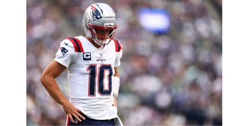 Drake Maye #10 of the New England Patriots stands on the field Wednesday during the NFL football game against the Seattle Seahawks at Lumen Field in Seattle, Washington.