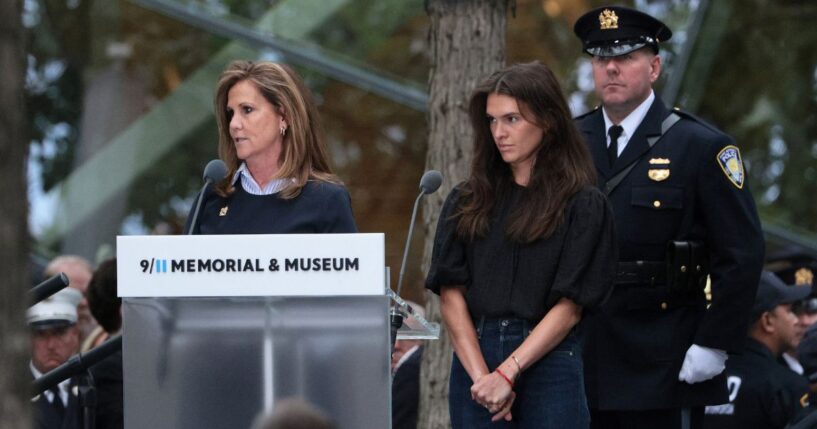 Terry Strada, left, widow of Tom Strada, reads the names of loved ones lost during a ceremony commemorating the 25th anniversary of the Sept. 11 terrorist attacks on the World Trade Center at the National 9/11 Memorial & Museum in New York City.