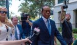 Tiger Woods, accompanied by Vanessa Trump, left, attends a hearing at Martin County Courthouse Wednesday in Stuart, Florida, in connection with a crash that occurred on Jupiter Island in March.