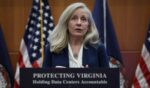 Virginia Democratic Gov. Abigail is pictured in a Sept. 18 file photo from a news conference where the lectern was adorned with the slogan, "Protect Virginia."