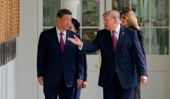 President Donald Trump escorts Chinese President Xi Jinping at the White House on Thursday, accompanied by first lady Melania Trump and Chinese first lady Peng Liyuan.