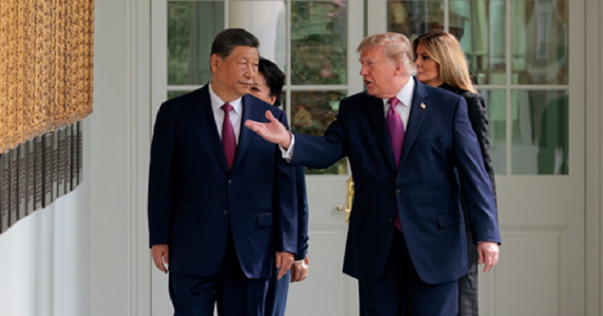 President Donald Trump escorts Chinese President Xi Jinping at the White House on Thursday, accompanied by first lady Melania Trump and Chinese first lady Peng Liyuan.